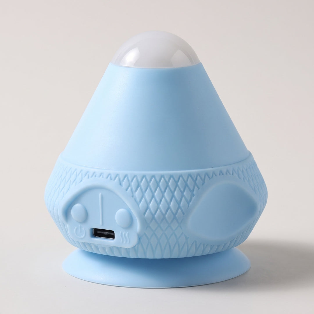 Elektrisk massageboll med sugpropp i ljusblått – vibrerande triggerpunktsmassage